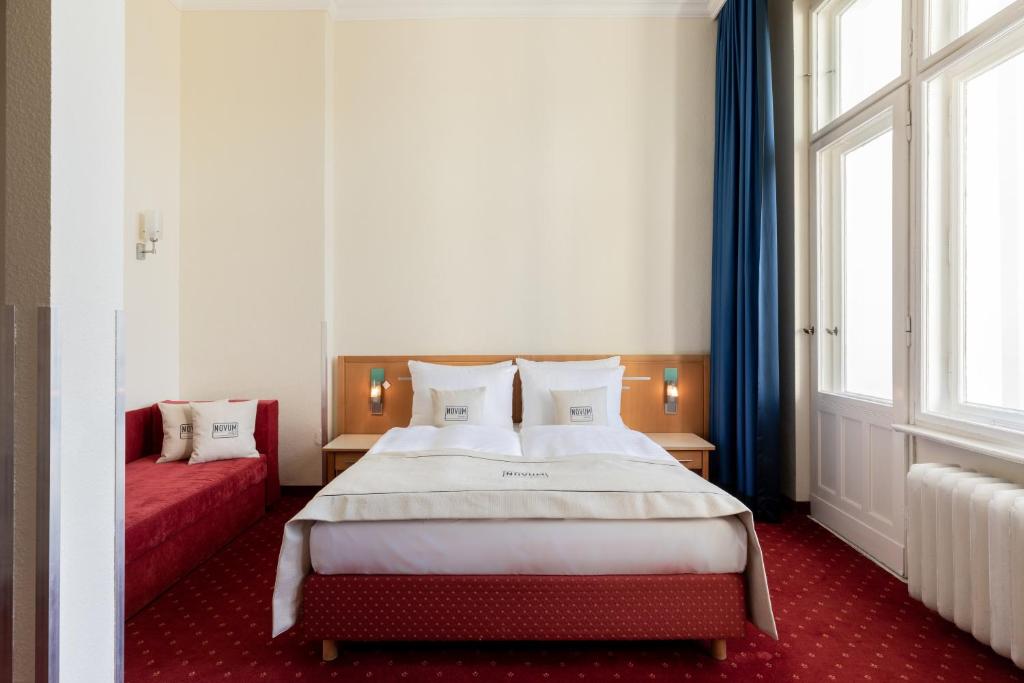 Ein Bett oder Betten in einem Zimmer der Unterkunft Novum Hotel Gates Berlin Charlottenburg
