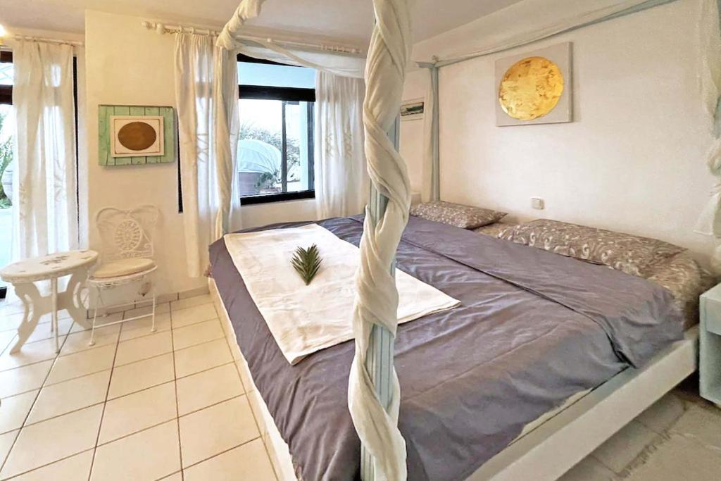 Łóżko lub łóżka w pokoju w obiekcie Villa Marga