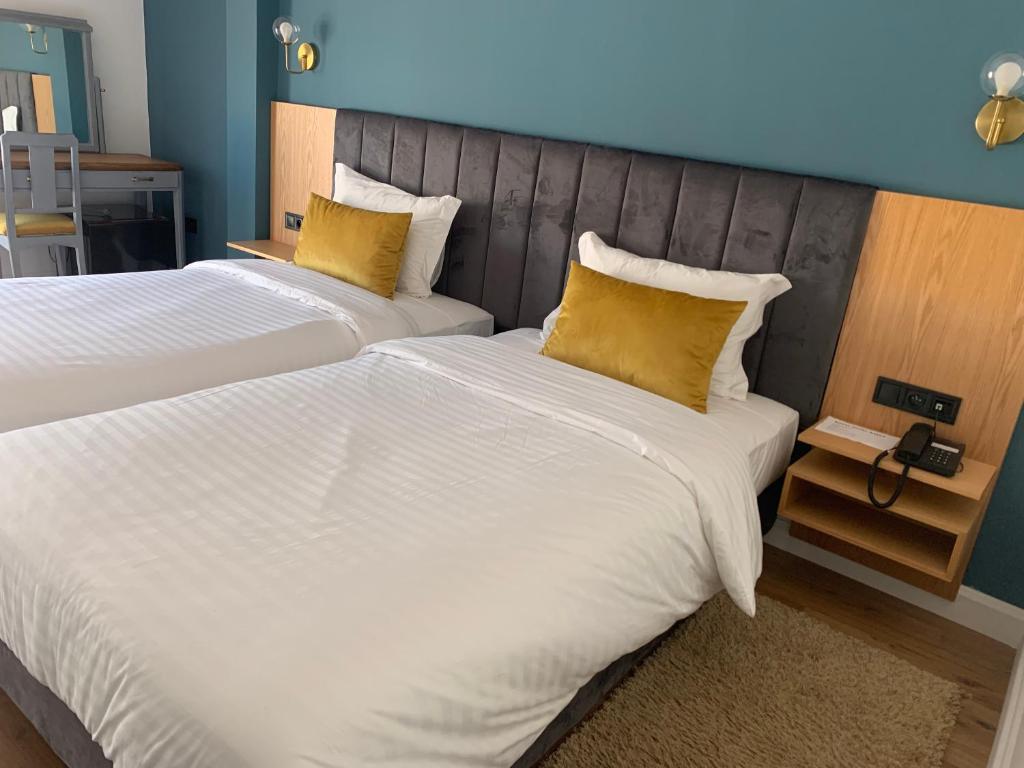 Postel nebo postele na pokoji v ubytování Royal Hotel Rabat