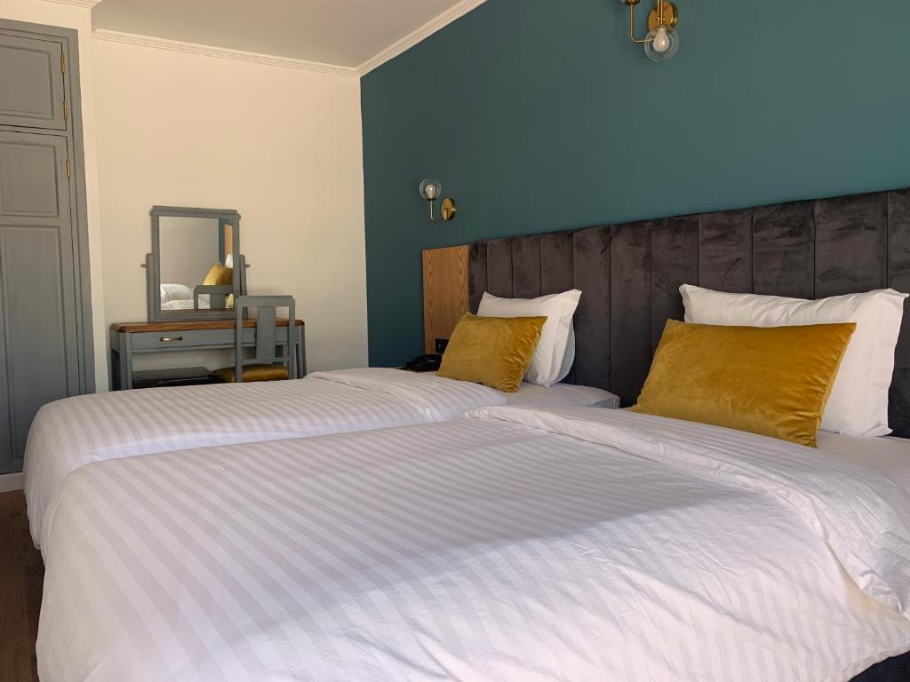 Postel nebo postele na pokoji v ubytování Royal Hotel Rabat