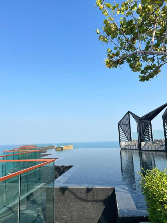 a building with a view of the water at Edge Central Pattaya Condo หรูใจกลางเมืองพัทยา in Pattaya Central