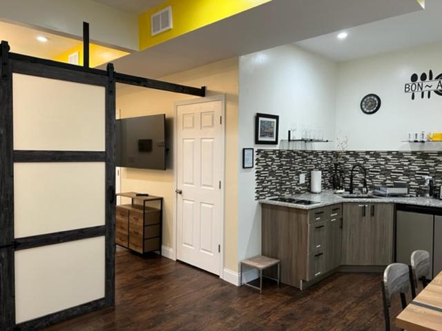 a room with a kitchen with a counter top at Uber Close to Ohio City, Cleveland (Lower) in Cleveland