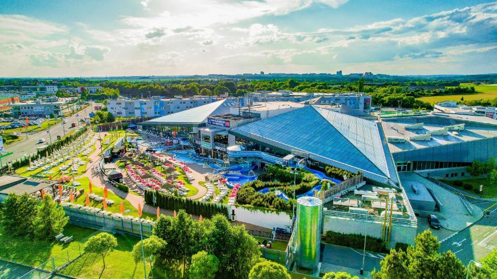 an aerial view of a city with a amusement park at Aquapalace Hotel Prague in Čestlice