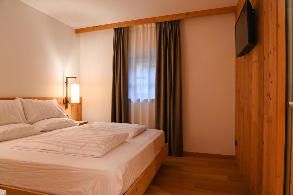 Postel nebo postele na pokoji v ubytování B&B Fontanella