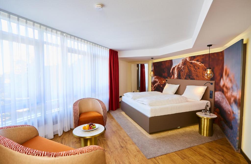 Postel nebo postele na pokoji v ubytování Das Schokoladenhotel