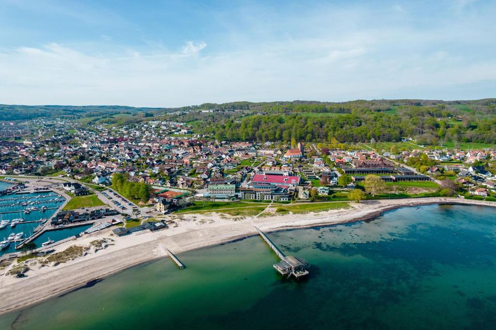 an aerial view of a town with a beach at Hotel Skansen Båstad in Båstad