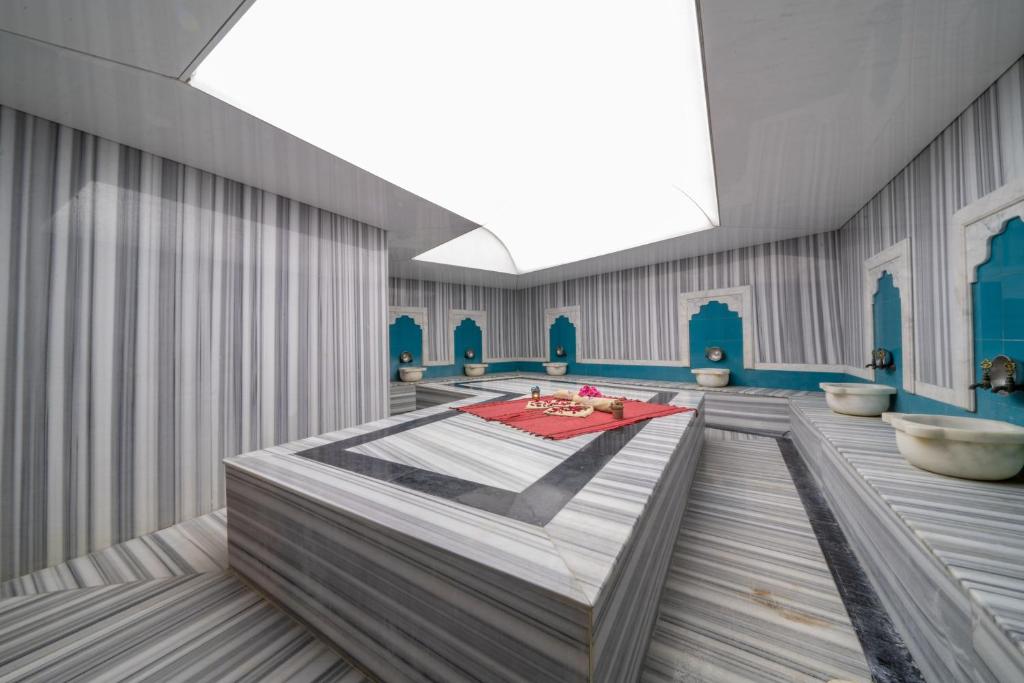 A bed or beds in a room at Yasmin Bodrum Resort