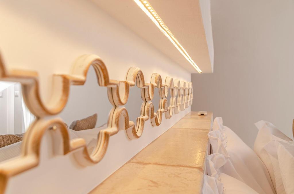 Postel nebo postele na pokoji v ubytování Apulia Charming Suites - Casa Rossa Suite Perla e Suite Corallo