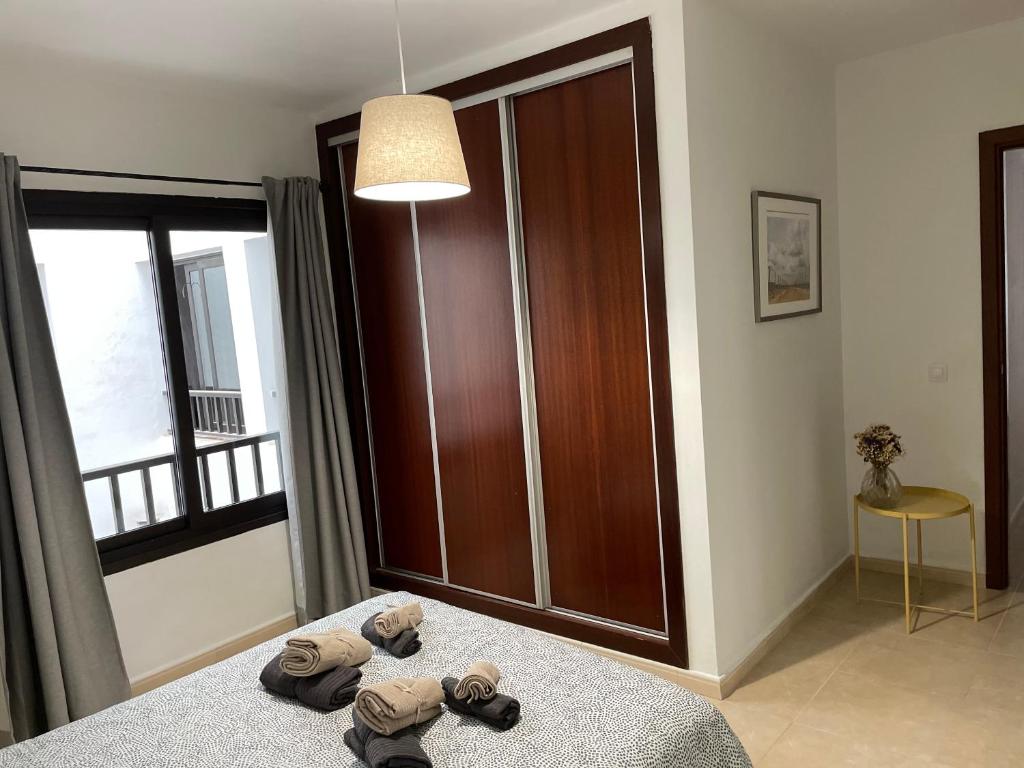 Postel nebo postele na pokoji v ubytování Increíble apartamento en pleno centro de Arrecife con parking privado