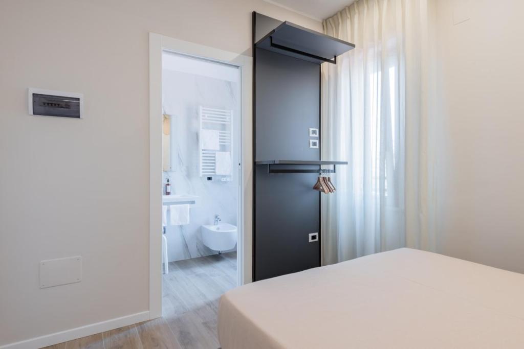 Postel nebo postele na pokoji v ubytování Albergo Degli Amici