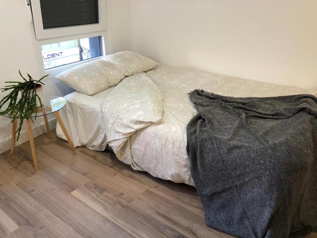Кровать или кровати в номере Apartamentos CANDEA