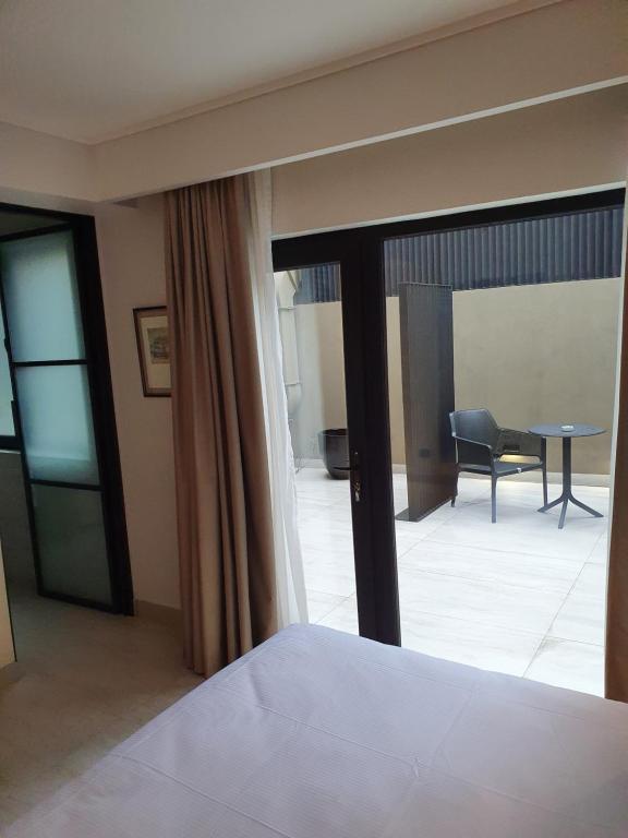 Postel nebo postele na pokoji v ubytování Lastarria Hotel