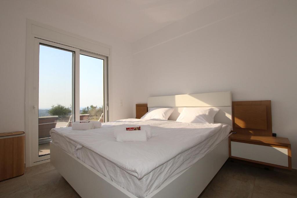 Postel nebo postele na pokoji v ubytování Sunset Sea View Villa 8