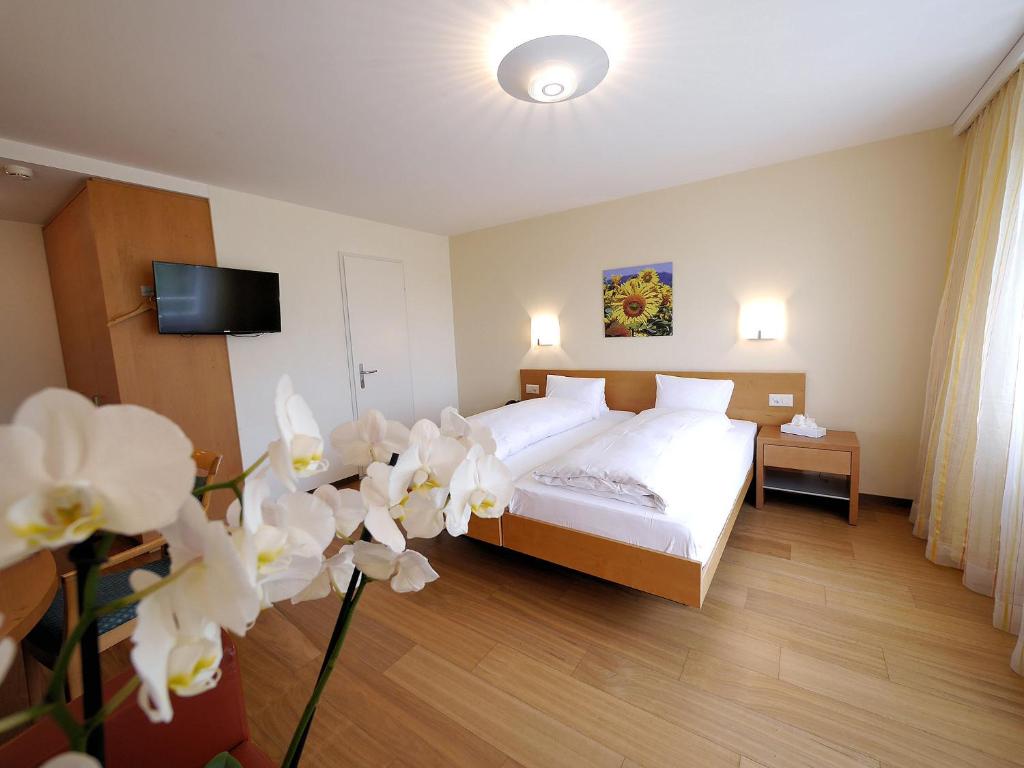 Postel nebo postele na pokoji v ubytování Hotel Restaurant Eichberg