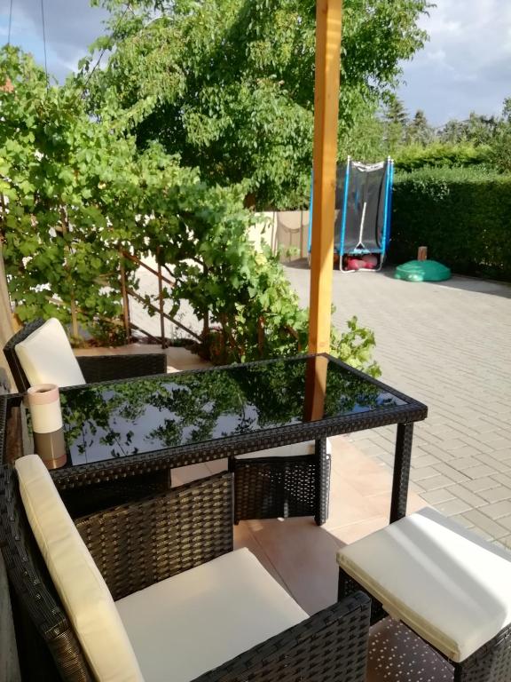 a table and chairs sitting on a patio at Ferienwohnung Nico in Stadtilm