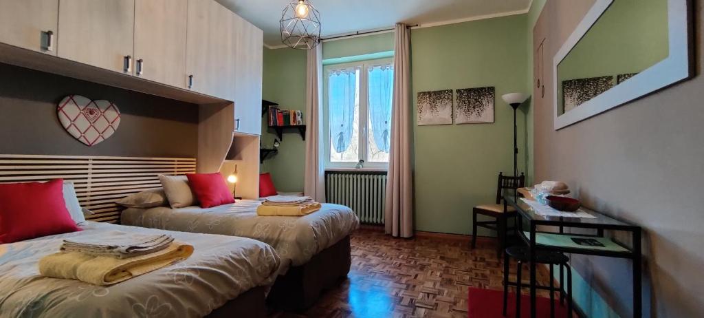 Postel nebo postele na pokoji v ubytování Le rose di Mapi