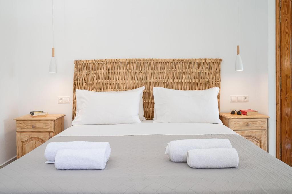 a bedroom with a large bed with two white pillows at Amalia in Matala