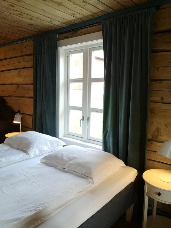 Postel nebo postele na pokoji v ubytování Tranøya