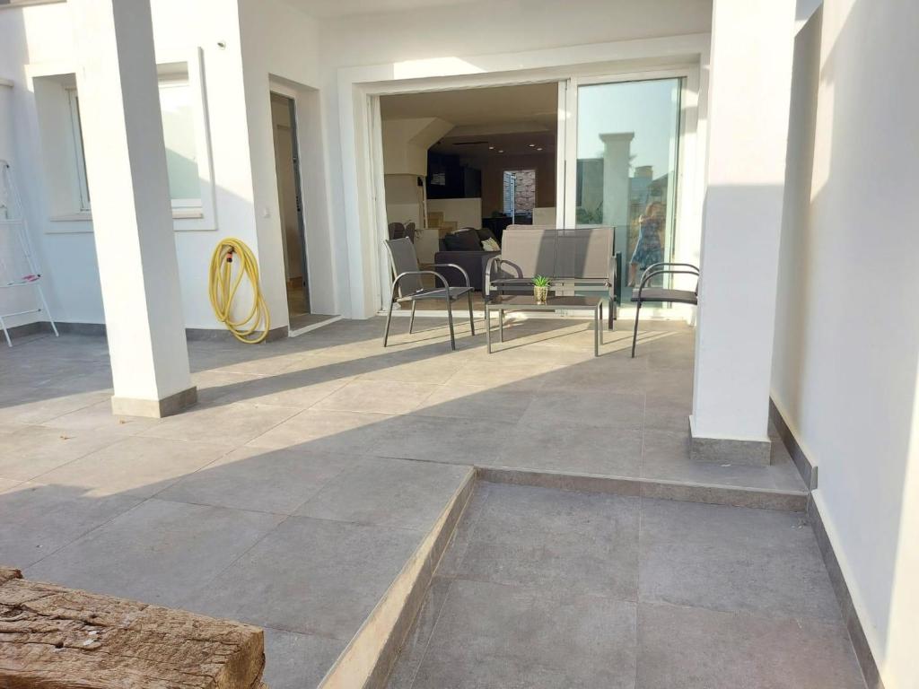 Posezení v ubytování Vivienda adosada agradable y cómoda cerca del mar