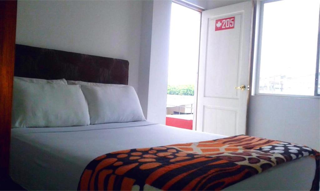 Postel nebo postele na pokoji v ubytování Bahia B&B
