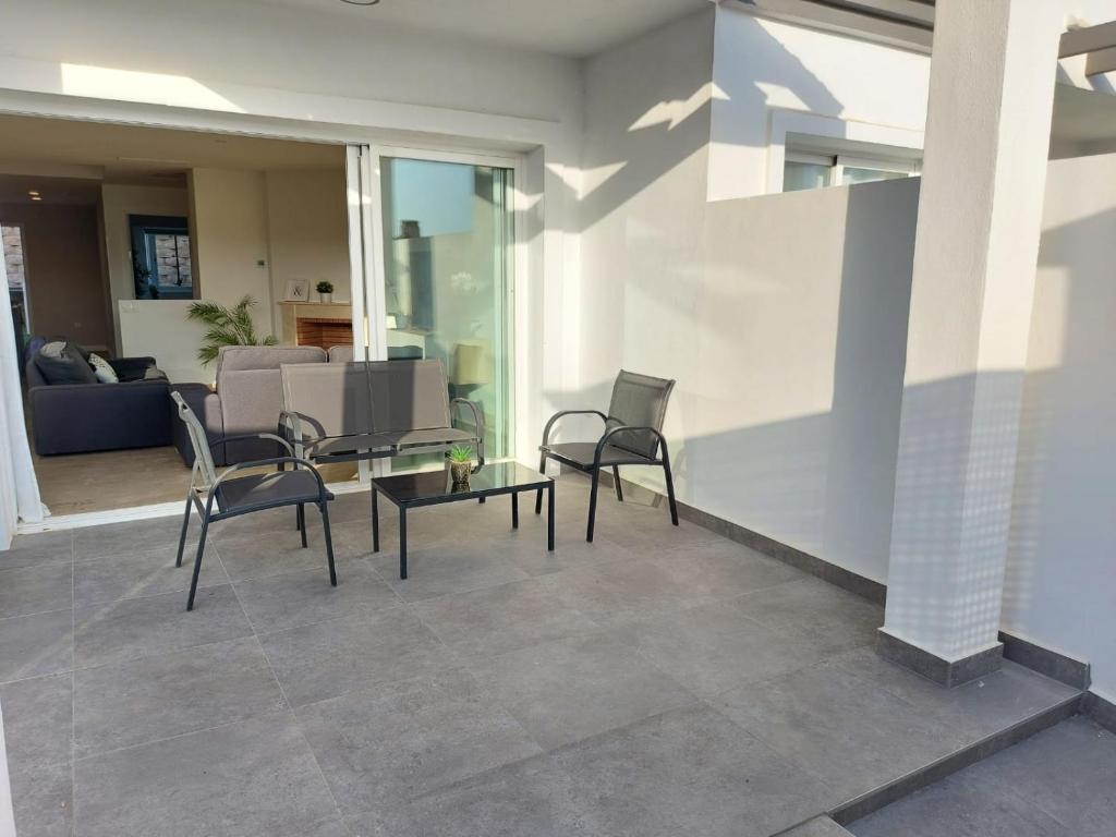 Posezení v ubytování Vivienda adosada agradable y cómoda cerca del mar