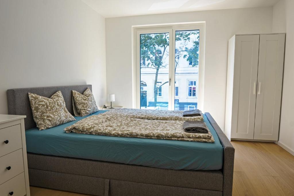 Posteľ alebo postele v izbe v ubytovaní Vienna City Apartments 1140 Vienna