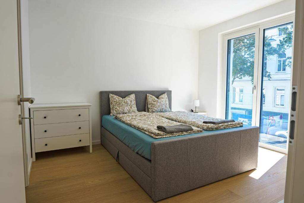 Posteľ alebo postele v izbe v ubytovaní Vienna City Apartments 1140 Vienna
