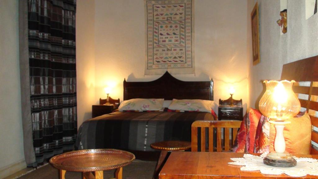Postel nebo postele na pokoji v ubytování Riad Arambys