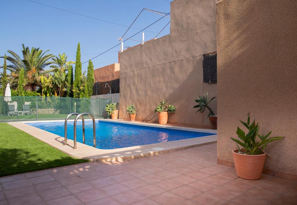 a swimming pool in the backyard of a house at LA VILLA DE CABO DE PALOS in Cabo de Palos