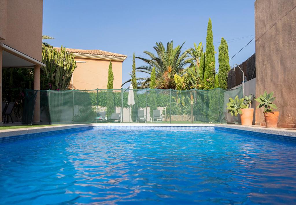 a swimming pool with blue water in a house at LA VILLA DE CABO DE PALOS in Cabo de Palos