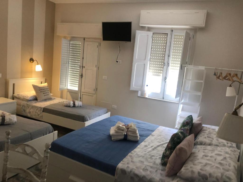 Postel nebo postele na pokoji v ubytování Solidea House