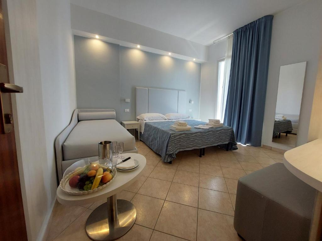 Postel nebo postele na pokoji v ubytování Hotel Caravel Park
