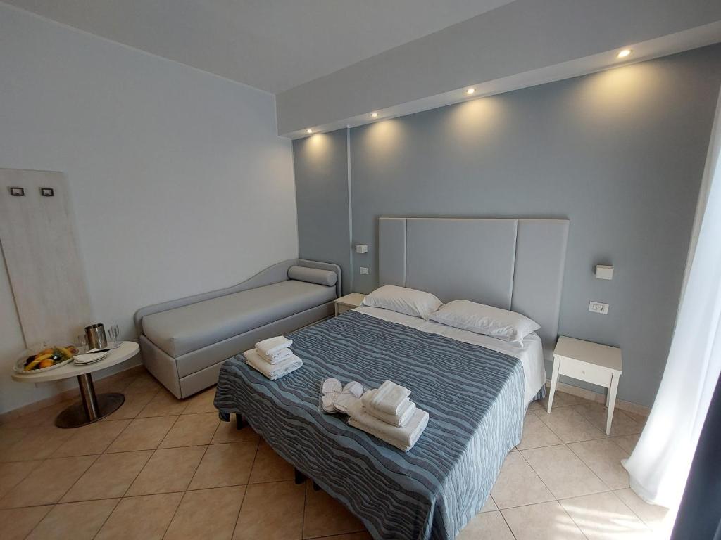 Postel nebo postele na pokoji v ubytování Hotel Caravel Park