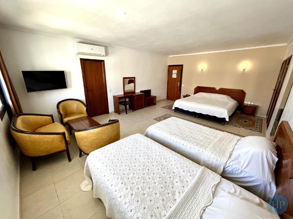 Postel nebo postele na pokoji v ubytování Hôtel Plaisance