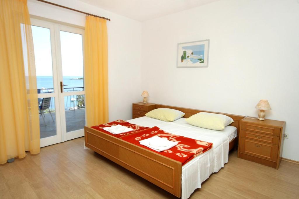 Postel nebo postele na pokoji v ubytování Apartment Molunat 3544a