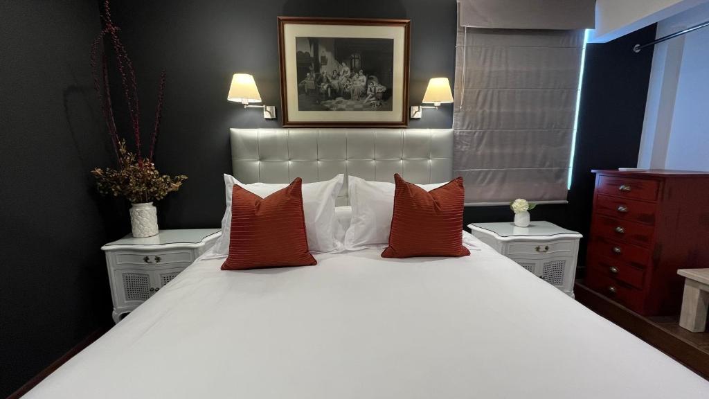Postel nebo postele na pokoji v ubytování Ana Frank Boutique Hotel