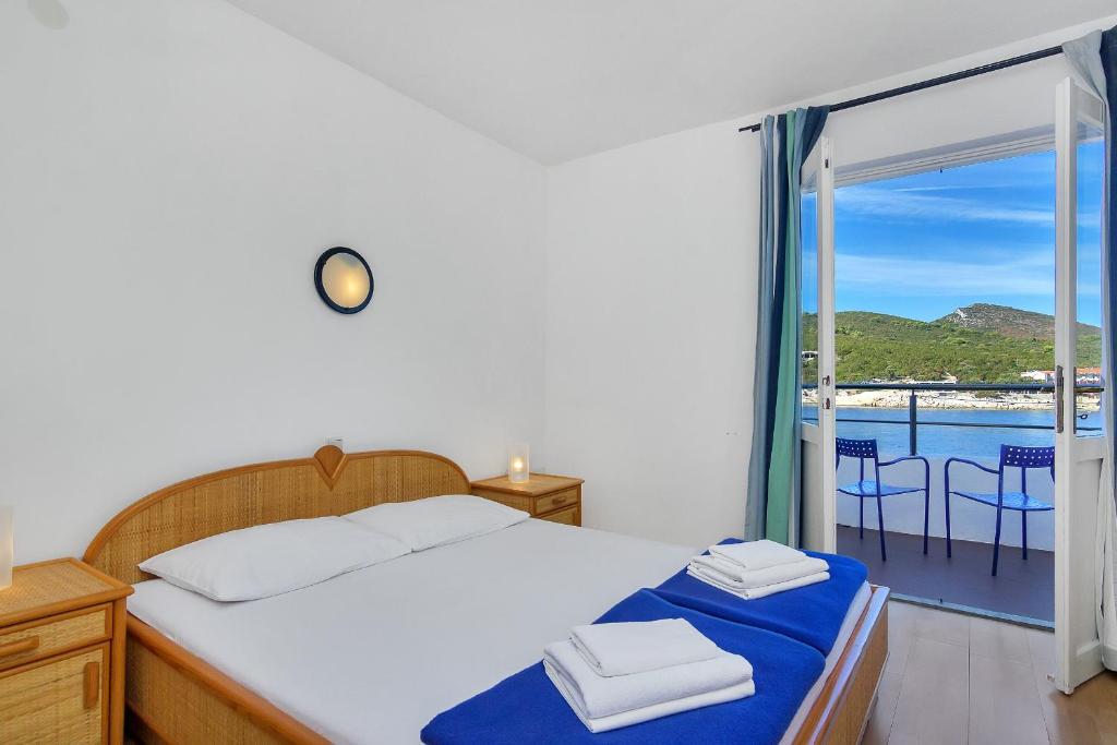 Posteľ alebo postele v izbe v ubytovaní Rooms by the sea Cove Pokrivenik, Hvar - 2069