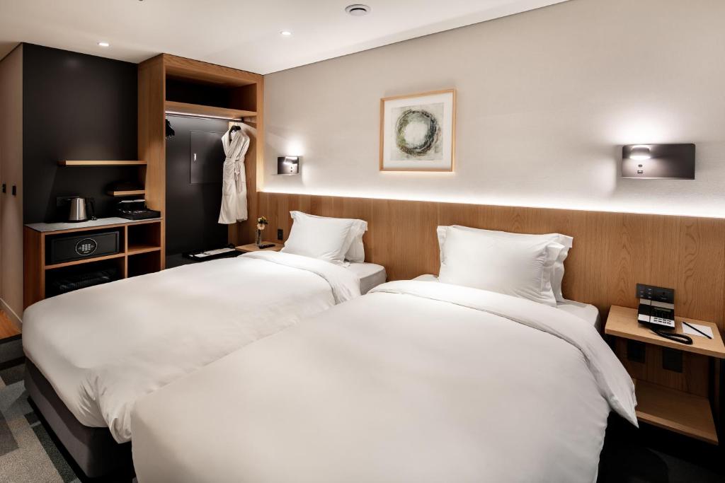 Cama ou camas em um quarto em G3 Hotel Chungmuro