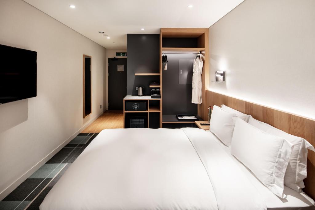 Cama ou camas em um quarto em G3 Hotel Chungmuro