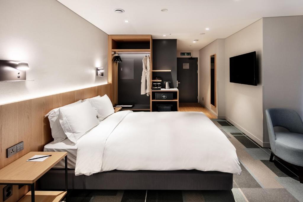 Cama ou camas em um quarto em G3 Hotel Chungmuro