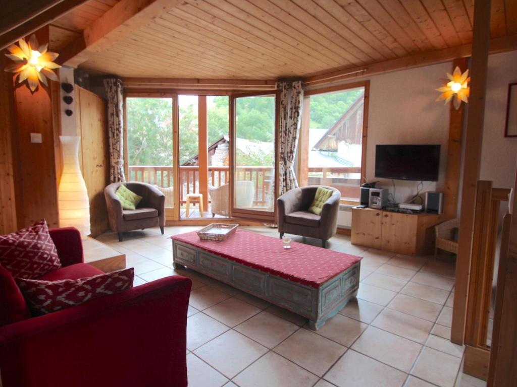 a living room with a couch and a coffee table at Chalet Valloire, 4 pièces, 8 personnes - FR-1-263-517 in Valloire