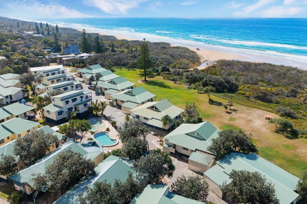 an aerial view of a resort with the beach at Fraser Island Beach Houses in K'gari Island (Fraser Island)
