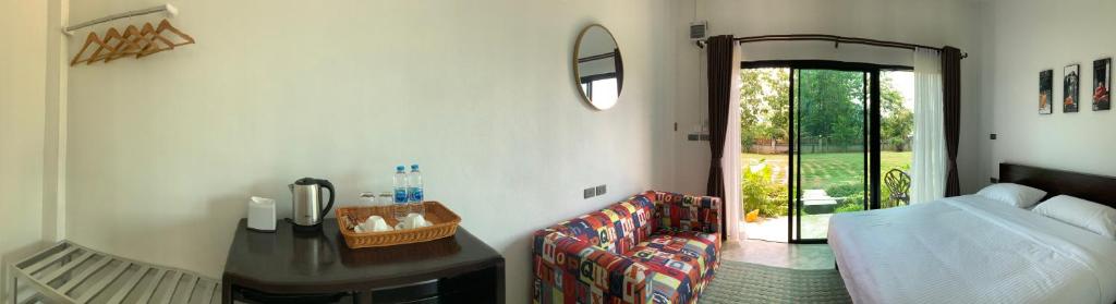 Postel nebo postele na pokoji v ubytování Saythong boutique hotel
