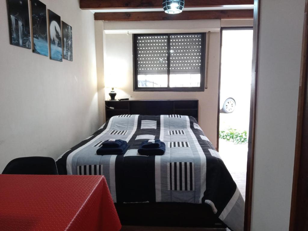 מיטה או מיטות בחדר ב-EL MONO DE LU