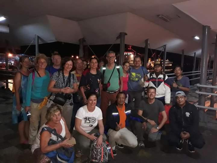 a group of people posing for a picture at Dannu's Homestay & Ijen, Bromo, Meru Betiri Sukomade Tours in Banyuwangi