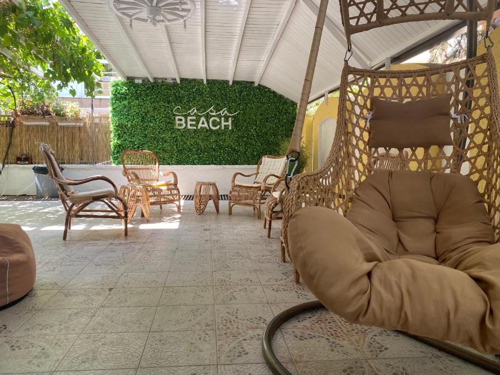 aented room with chairs and chairs and a sign that says beach at Casa Beach in Ravda