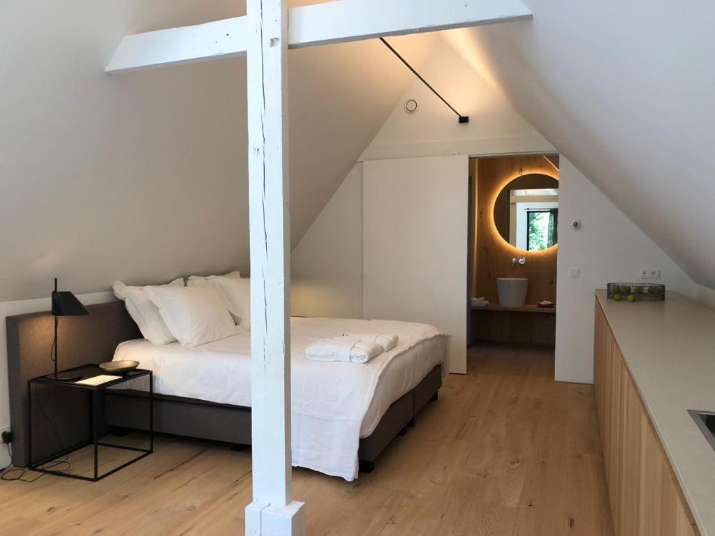 En eller flere senge i et værelse på Het Wagenhuis