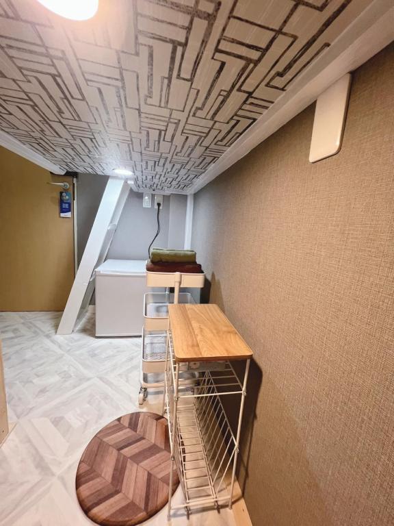 Postel nebo postele na pokoji v ubytování 誠家　MAKOTO HOSTEL