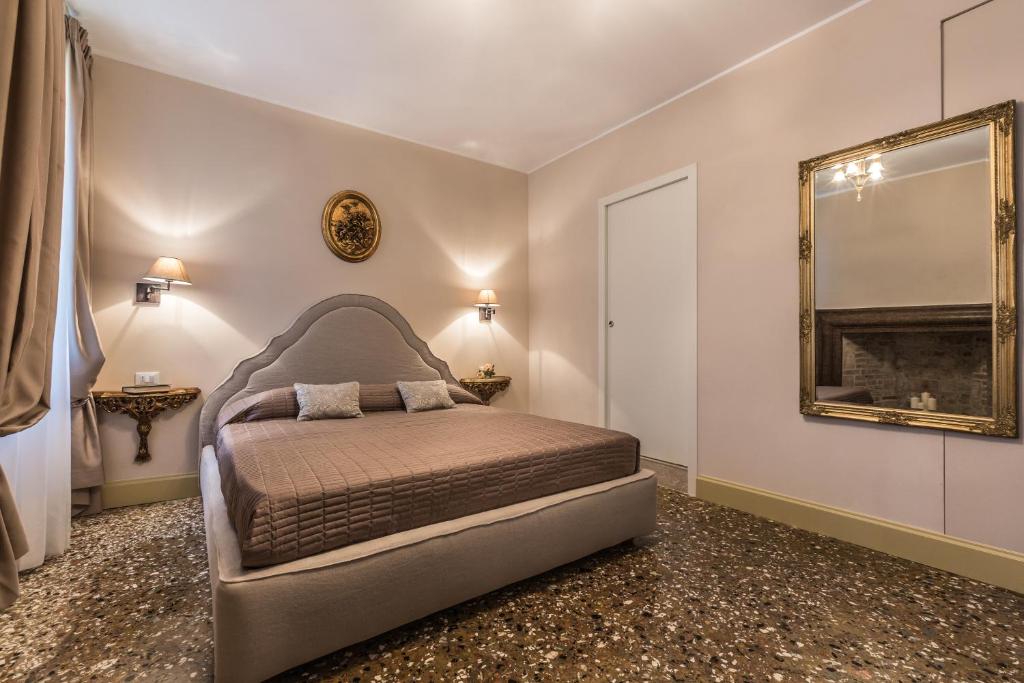 Posteľ alebo postele v izbe v ubytovaní Palazzina Canal