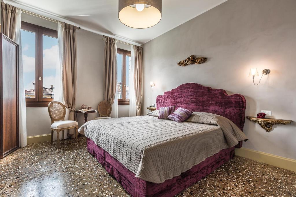 Posteľ alebo postele v izbe v ubytovaní Palazzina Canal